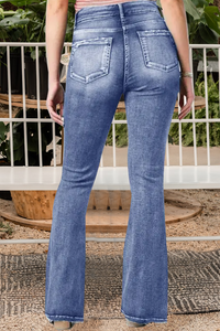 Jeans vintage cintura média flare botão lateral